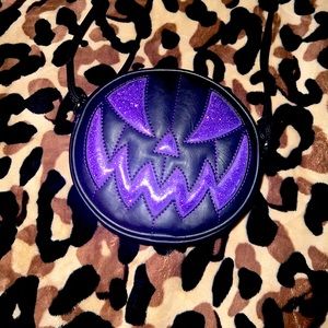 Small Pumpkin Kult crossbody bag! Matte black with purple glitter detailing.